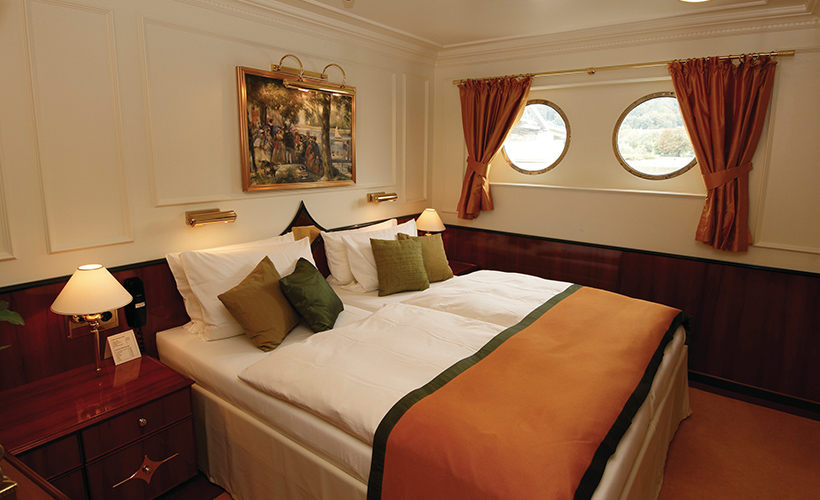 The Premium Suite cabin on the Royal Crown cruise ship of Hebridean Island Cruises