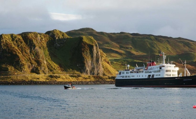 The Hebridean Princess moored on the shores of a Scottish Isle