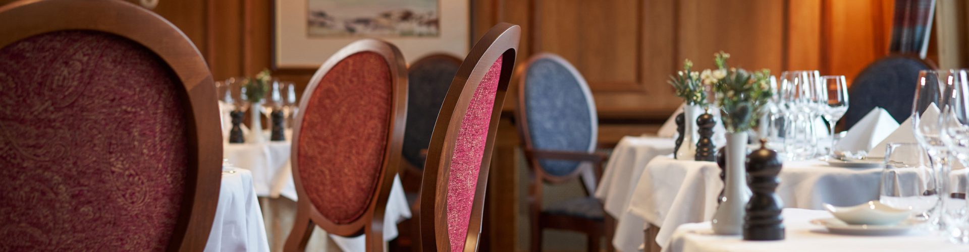 Tables and chairs in restaurant on the Hebridean Princess cruise ship
