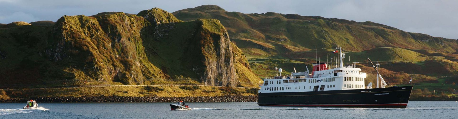 The Hebridean Princess moored on the shores of a Scottish Isle