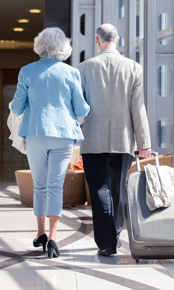 Couple walking with luggage