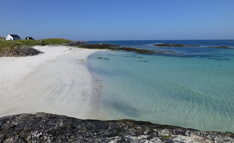 The white sands and clear waters of Caolas beach on the Isle of Tiree in Scotland