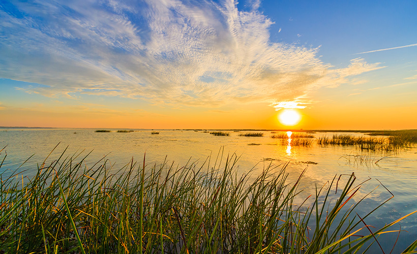 The Danube Delta at sunset where the Sulina Channel meets the Black Sea in Romania