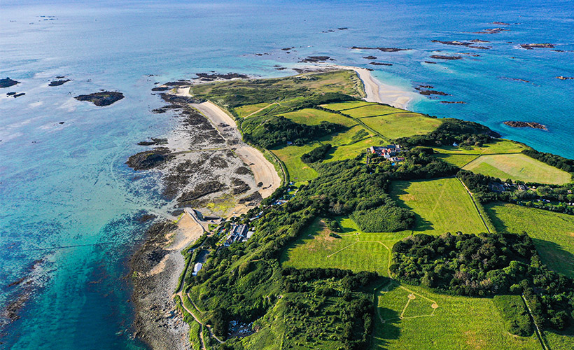 An aerial view of the coastline of Herm Island