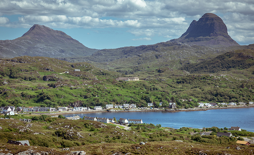 The port of Lochinver with mountains in the background