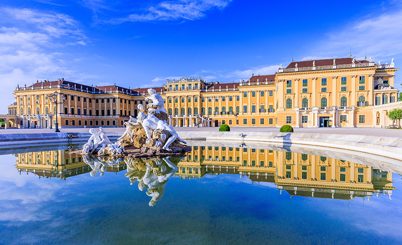 Schönbrunn Palace Vienna with the beautiful statues in the the water in the foreground